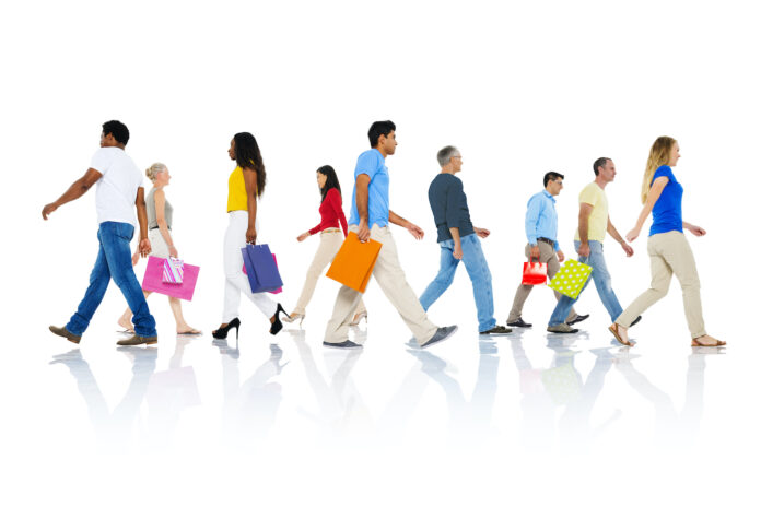 mainstream retail shoppers walking with bags from different stores