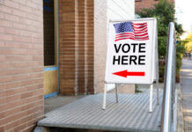 Cannabis on the Ballot Expected to Draw Millions of Voters Polling place with vote here sign by Andrey Popov mg Magazine