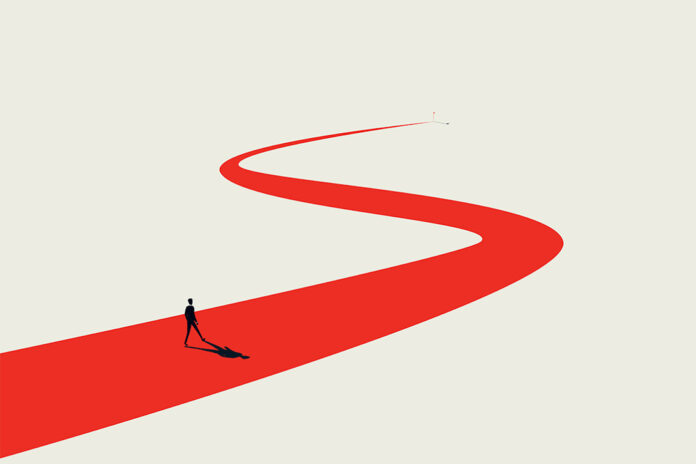 business person walking on winding line objective long road