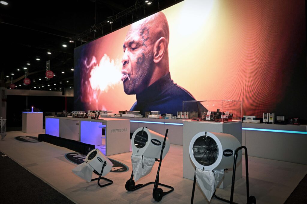 Front view of Futurola’s product display with Mike Tyson branding at MJBizCon 2024.