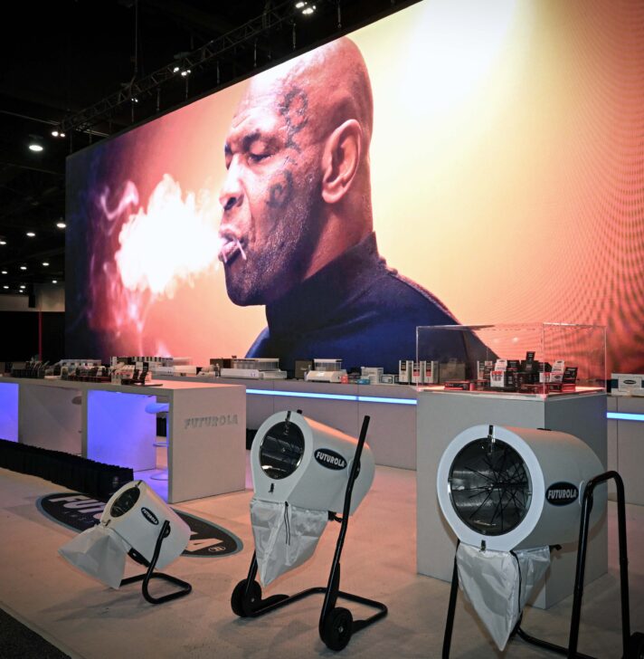 Front view of Futurola’s product display with Mike Tyson branding at MJBizCon 2024.