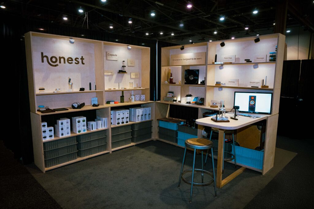 Honest booth at MJBizCon 2024 showcasing minimalist product displays and eco-friendly packaging solutions.