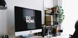 Think different: Cannabis Branding Lessons I Learned at Apple Modern home office desk setup with Apple iMac displaying “Do More.” on screen, symbolizing productivity and minimalist cannabis branding inspiration.