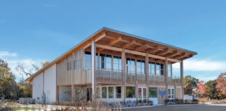 Rooted in Resilience: Inside Little Beach Harvest Little Beach Harvest dispensary building exterior featuring wood cladding and large windows, reflecting Shinnecock Nation’s natural aesthetic and modern architecture.