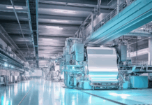 Paper Innovations Transform Cannabis Products and Packaging Advanced paper production facility showcasing large-scale machinery used in the manufacturing of lightweight and sustainable paper for packaging and rolling products.