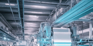 Paper Innovations Transform Cannabis Products and Packaging Advanced paper production facility showcasing large-scale machinery used in the manufacturing of lightweight and sustainable paper for packaging and rolling products.