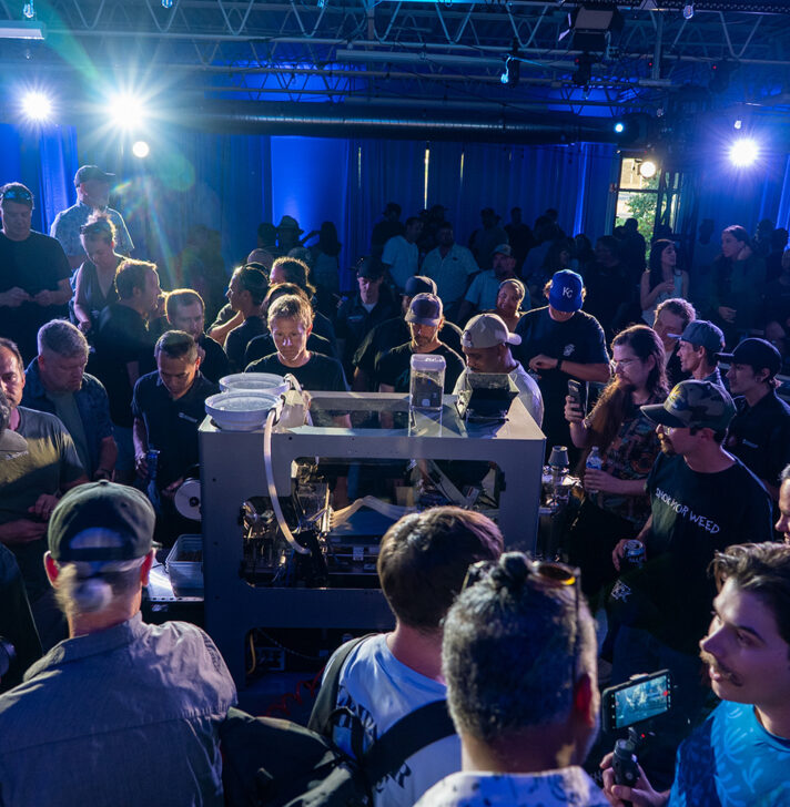 Attendees watch live demo of RollPros Blackbird XXL blunt-rolling machine