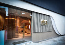 Alta Brings Family Legacy and Feminine Wellness to NYC Dispensary Alta Dispensary storefront in Nolita-Chinatown, New York City, featuring modern architectural elements and a curved wall design with illuminated signage.