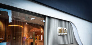 Alta Brings Family Legacy and Feminine Wellness to NYC Dispensary Alta Dispensary storefront in Nolita-Chinatown, New York City, featuring modern architectural elements and a curved wall design with illuminated signage.