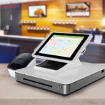 IndicaOnline POS: Turning Cannabis Retail Chaos into Profit IndicaOnline POS hardware system on a dispensary counter, including touchscreen register and receipt printer.