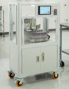 Full view of Xylem Robotics Y2 infused pre-roll automation machine on wheels with touchscreen interface in GMP-certified lab.