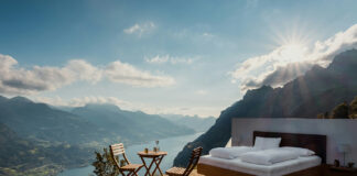 CBN: The Cannabinoid Redefining Natural Sleep Solutions Scenic outdoor bedroom overlooking mountain lake at sunrise, symbolizing natural and holistic sleep environments inspired by wellness practices.