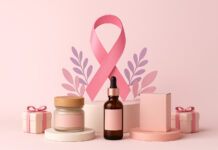 Cannabis Brands Making an Impact on Breast Cancer Awareness Pink breast cancer awareness ribbon surrounded by cannabis products, including flower, pre-rolls, and tincture bottles on a soft pink background.