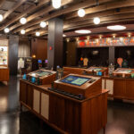 Klutch Cannabis Revives Cleveland’s Musical Landmark Wide-angle view of Klutch Cannabis retail floor featuring interactive display islands and product showcases in Cleveland dispensary.