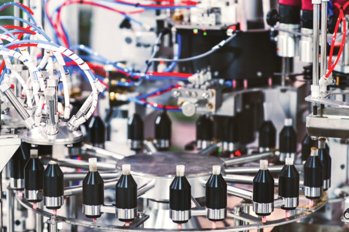 hefestus-pre-roll-automation-machine-hero High-precision Hefestus automation system used for advanced pre-roll manufacturing, featuring enclosed controls and illuminated internal components.