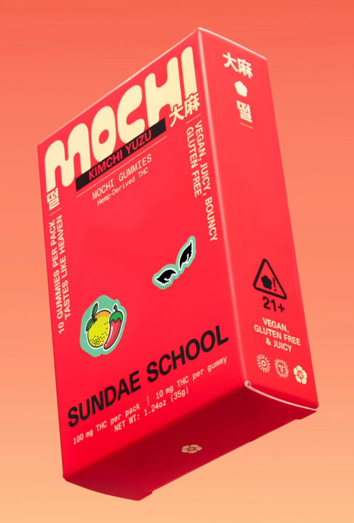 Bright red box of Sundae Flowers Kimchi Yuzu mochi gummies against a gradient orange background, showing bold typography and illustrated flavor icons.