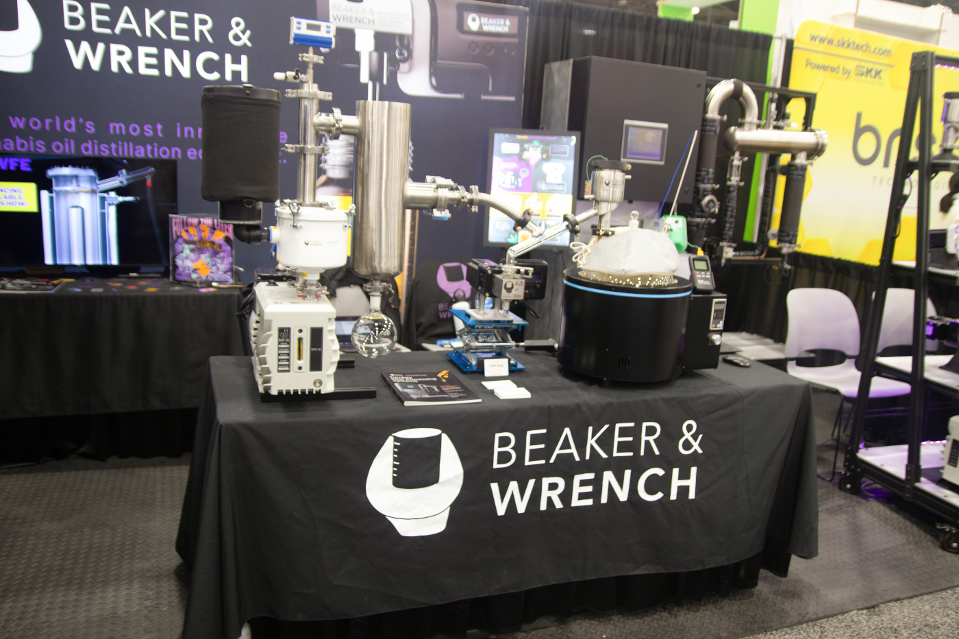Beaker & Wrench booth displaying cannabis oil distillation equipment at MJBizCon 2025.