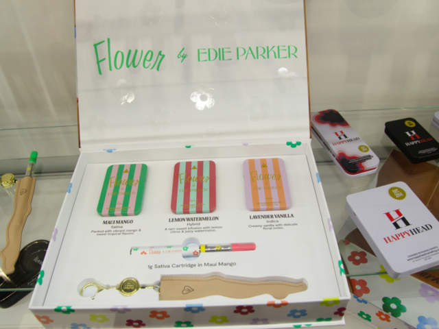 Flower by Edie Parker cannabis packaging and vape cartridge displayed at MJBizCon 2025.