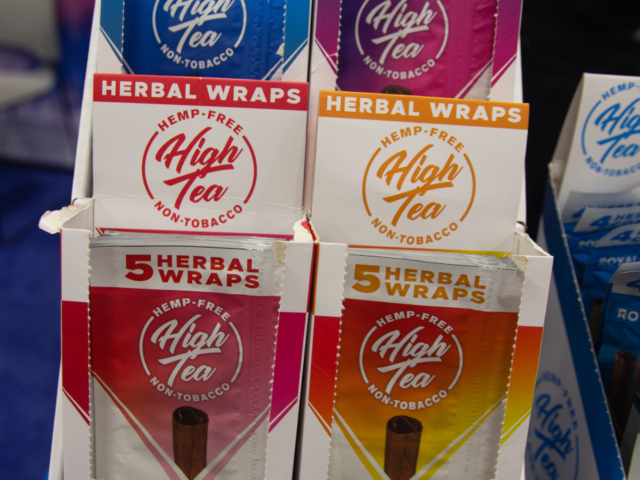 High Tea booth featuring hemp-free herbal wraps in multiple flavors at MJBizCon 2025.