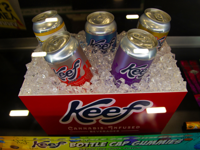 Keef&rsquo;s cannabis-infused beverage cans displayed on ice at MJBizCon 2025.