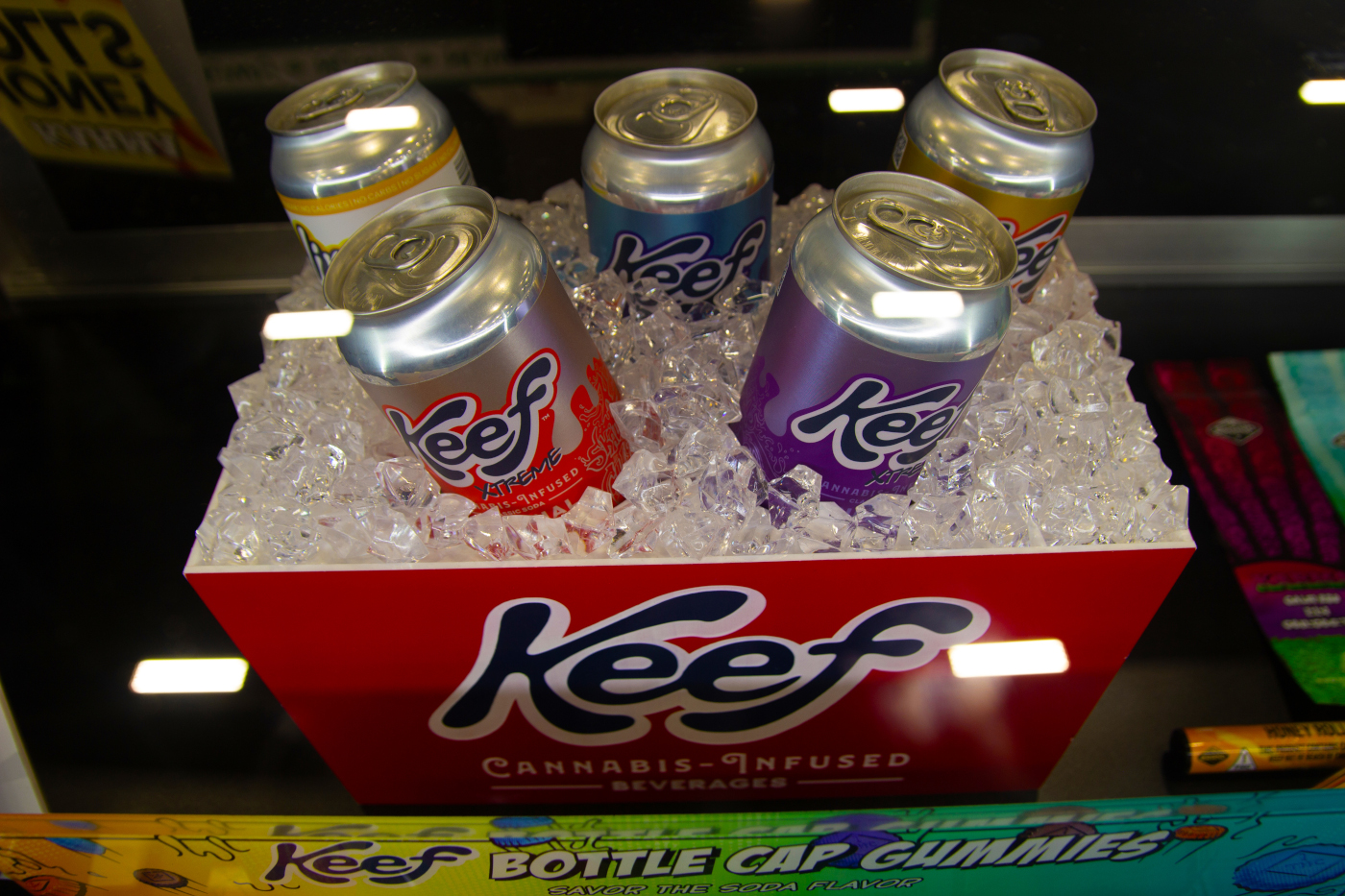 Keef’s cannabis-infused beverage cans displayed on ice at MJBizCon 2025.