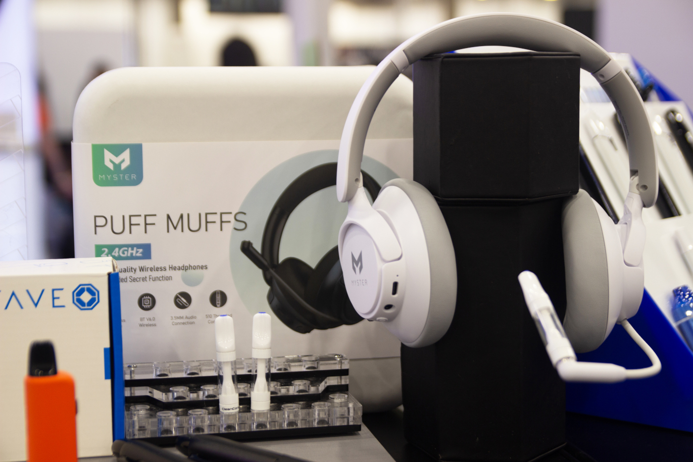 Myster's Puff Muffs wireless headphones and vape accessories on display at MJBizCon 2025.