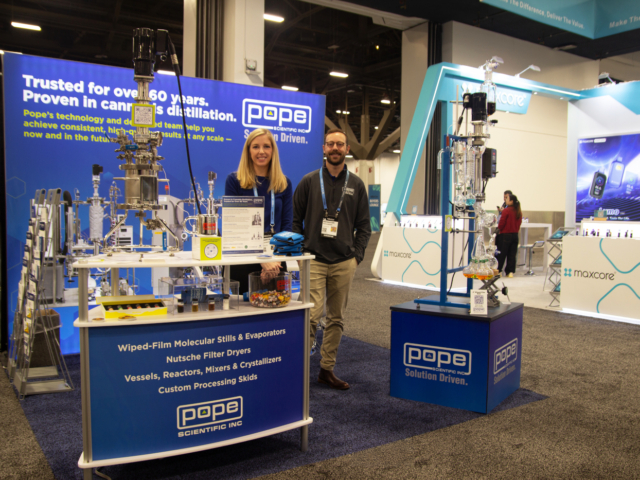 Pope Scientific booth featuring distillation and lab processing systems at MJBizCon 2025.