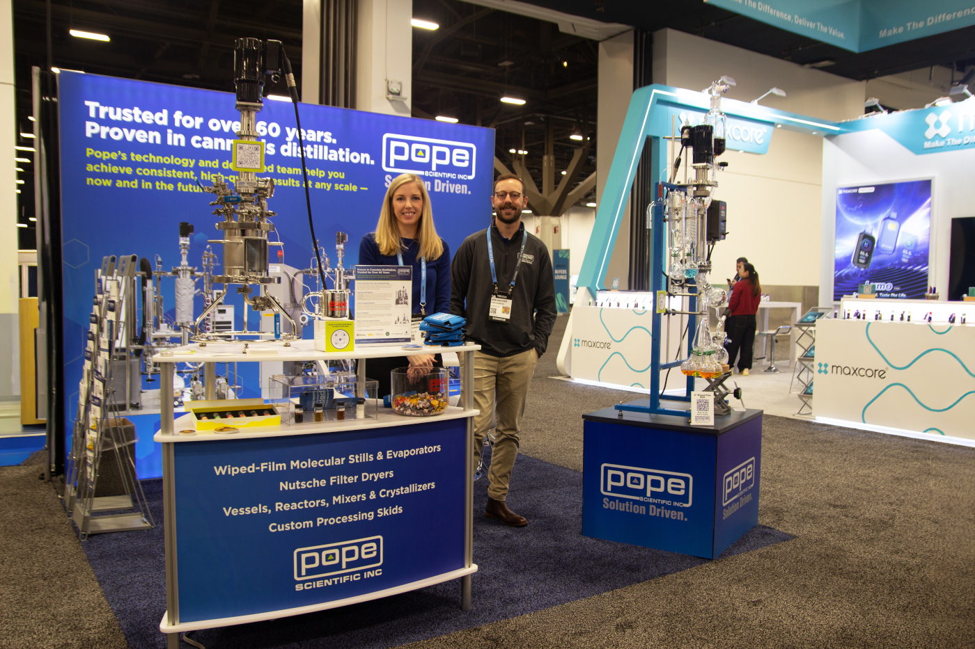 Pope Scientific booth featuring distillation and lab processing systems at MJBizCon 2025.