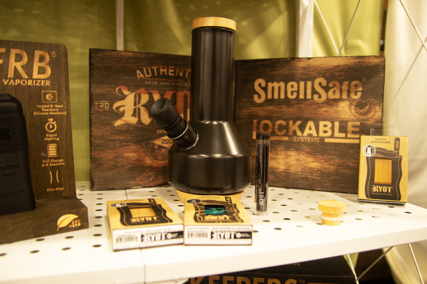 RYOT display featuring cannabis smoking accessories and SmellSafe lockable storage solutions at MJBizCon 2025.