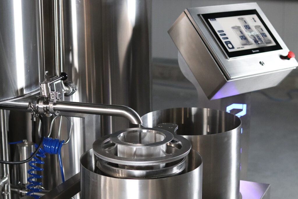 Stainless steel solventless extraction system with touchscreen interface for temperature and pressure control.
