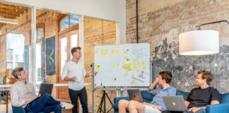 Surfside on Data-Driven Marketing and Why Attribution Matters Public relations and marketing team collaborating on communications strategy during an in-office planning session