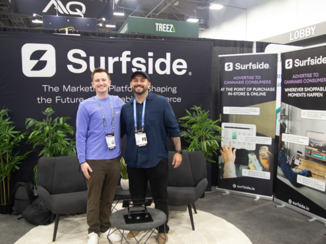 Surfside&rsquo;s marketing technology booth with two representatives at MJBizCon 2025.