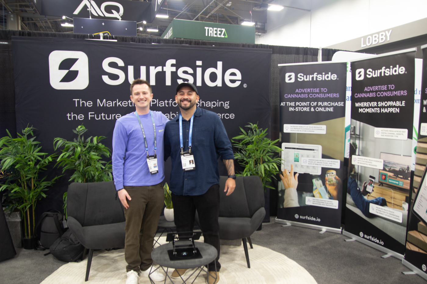 Surfside’s marketing technology booth with two representatives at MJBizCon 2025.