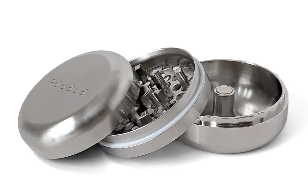 Stainless steel Pebble threadless grinder with a sculptural ash wood lid.