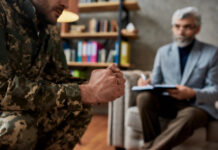 ASA Warns of ‘Access Crisis’ Ahead of 2026 Hemp Changes Clenched fists of a military veteran in uniform, representing the stress and frustration of the impending 2026 medical hemp access crisis.