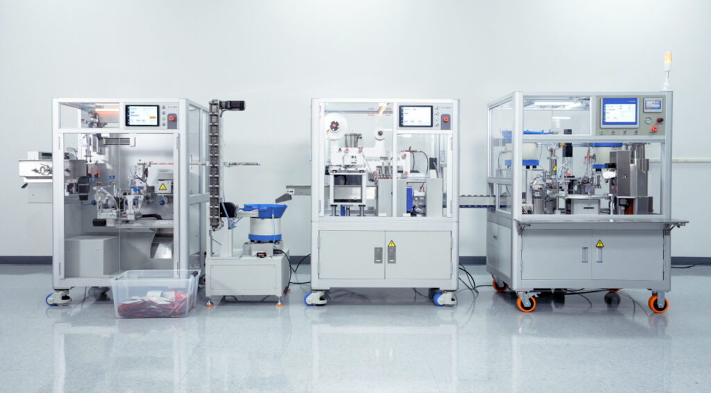 Automated vape cartridge packaging equipment arranged in a multi-stage production line.