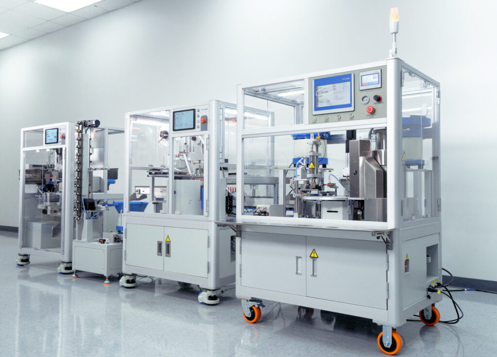 End-to-end automated vape packaging line with multiple enclosed stations in a clean facility.