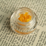 New Data Report Spotlights ‘Knowledge Gap’ Holding Back Cannabis Concentrates cannabis concentrate in a jar sitting on newsprint
