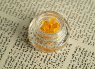 New Data Report Spotlights ‘Knowledge Gap’ Holding Back Cannabis Concentrates cannabis concentrate in a jar sitting on newsprint