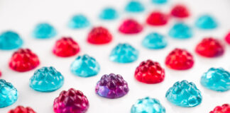 Vivid blue, red, and purple gummies made with natural color formulations.