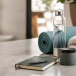 How Wellness Consumers Are Reshaping Cannabis Wellness items arranged beside an unbranded product container, representing consumers who use cannabis as part of functional lifestyle routines.