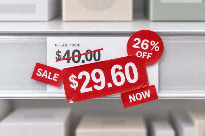 Cannabis Retail Discounts and Pricing Strategy Retail shelf price tag showing a $40 price marked down 26 percent to $29.60
