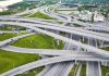 Aerial view of a highway interchange in Louisville, Kentucky, with multiple routes crossing and diverging.