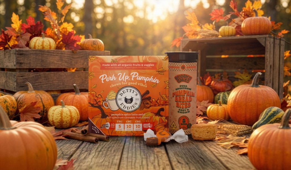 Betty’s Eddies pumpkin-spice fruit chews and Bubby’s Baked pumpkin-bread bites displayed among pumpkins and autumn foliage.